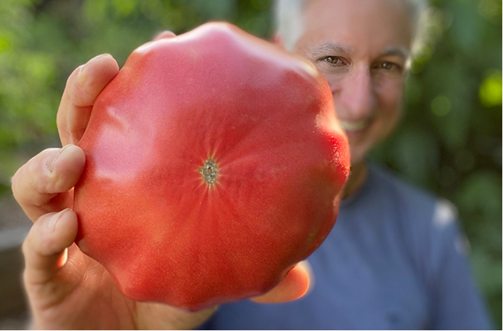 Joe Lamp'l with a large tomato